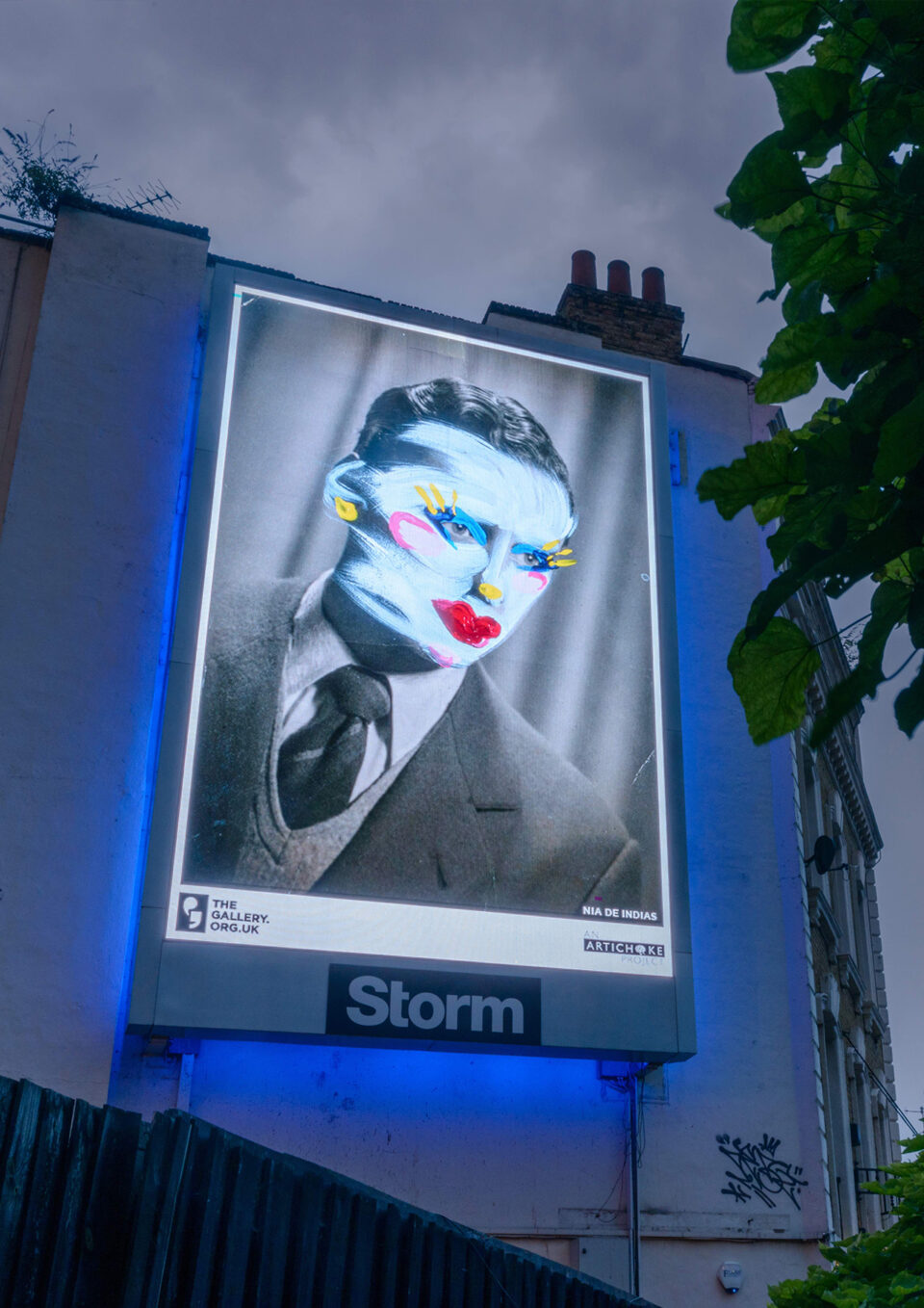 A photograph of a billboard on the side of a building featuring one of the artworks. The artwork is a old-style portrait of a man in a suit. The photograph has been then painted with colourful and contrasting drag-style makeup.